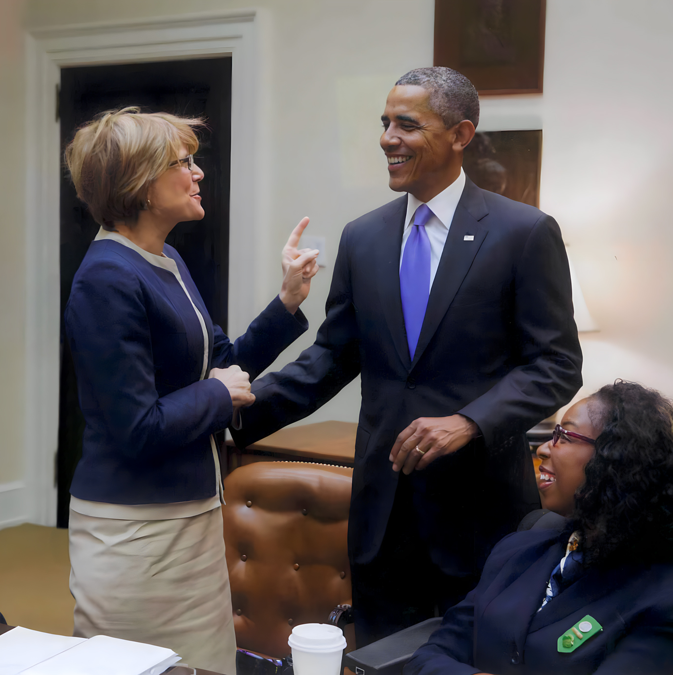 From left to right: Carol glazer shaking hands with President Barack Obama