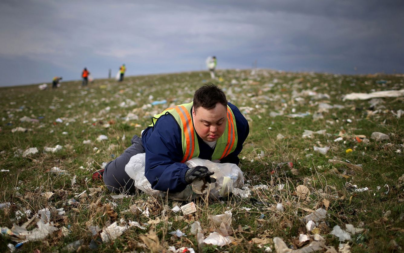 A man with Down syndrome picks up trash for his job earning subminimum wage in 2015. (David Joles/Star Tribune/TNS)