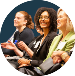 Three women in a circular frame smiling