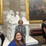 Beth Sirull, CEO and President of NOD stands behind Maria Town, President of AAPD. Both women are posing and smiling