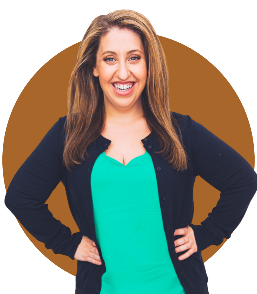 Pamela Headshot - she stands with her hands on her hips and a wide smile