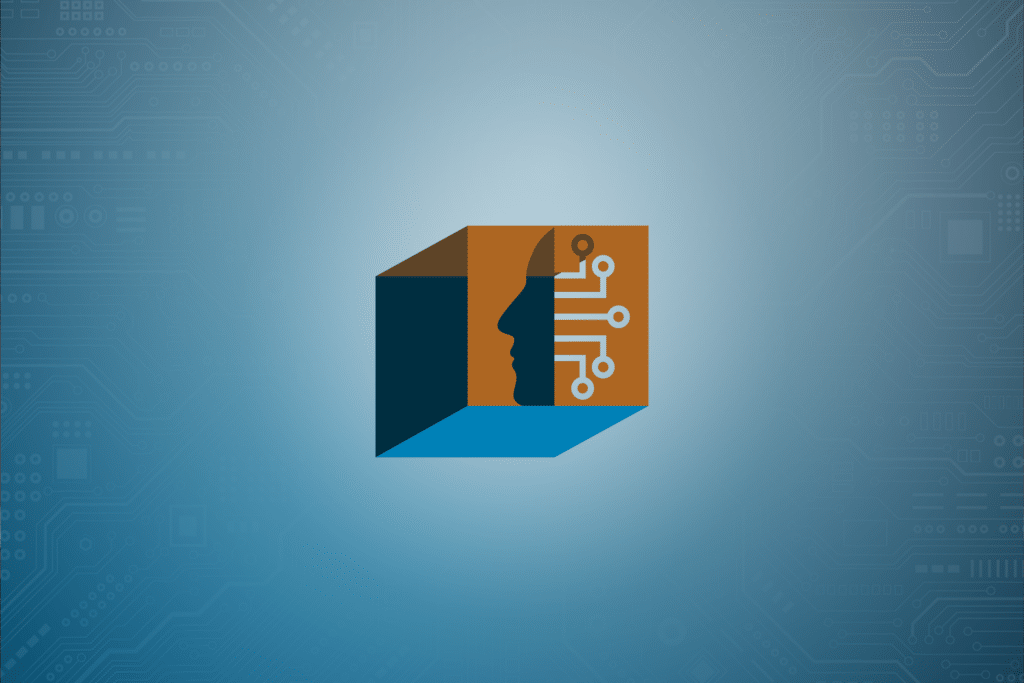 Abstract graphic of a cube with one face showing a human profile merged with circuit lines, symbolizing artificial intelligence or technology, set against a blue background with faint circuit board patterns