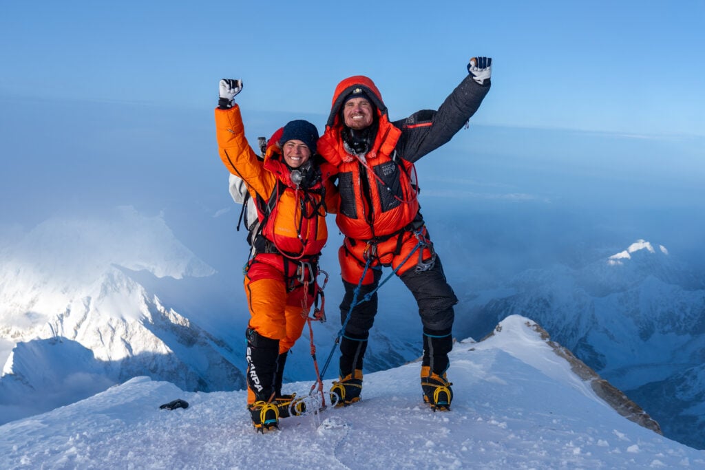 Scott and Shayna on the top of a mountain summit