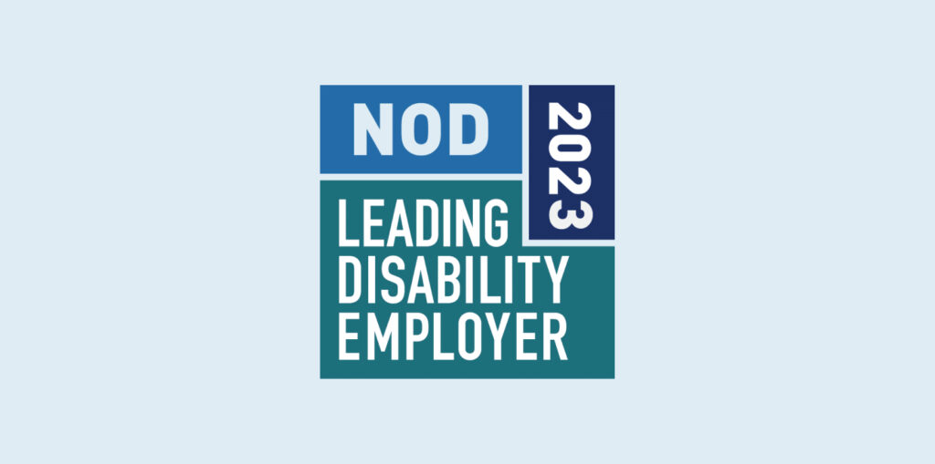 Blue and green badge reading "NOD Leading Disability Employer 2023," signifying recognition for inclusive employment practices.