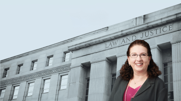 Baby blue-toned background with a monochromatic angled photo of a court building with the words "Law and Justice" visible. in the lower right corner is a headshot of Alissa A. Horvitz