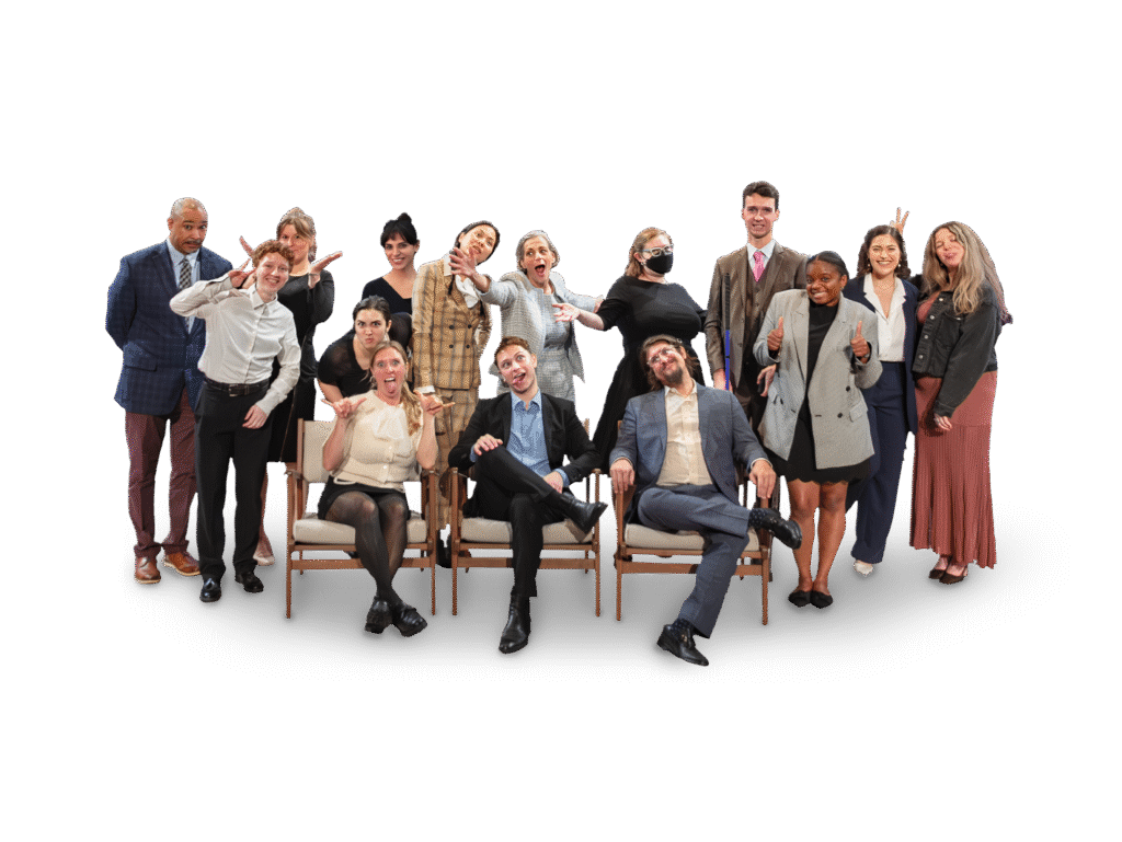 Full NOD team photo featuring staff members making silly faces with outstretched arms.
