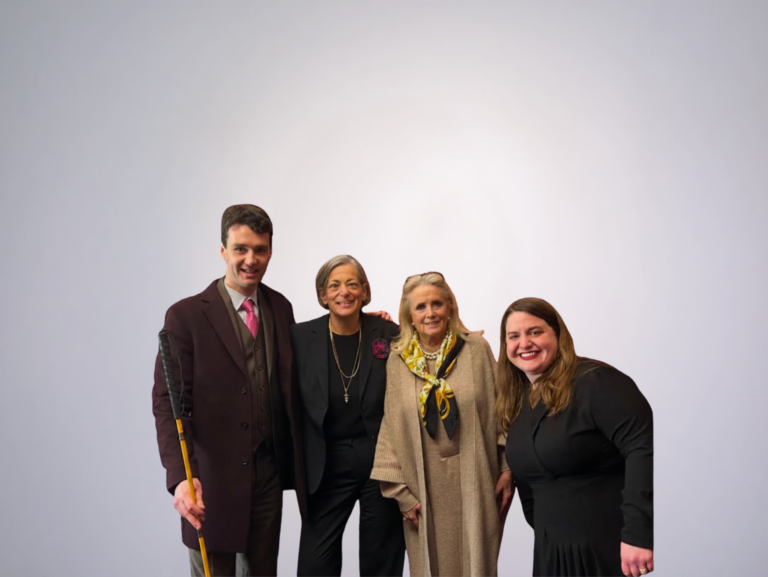 Charles-Edouard Catherine, Beth Sirull, Congresswoman Debbie Dingell, and Maria Town stand together in a congressional office