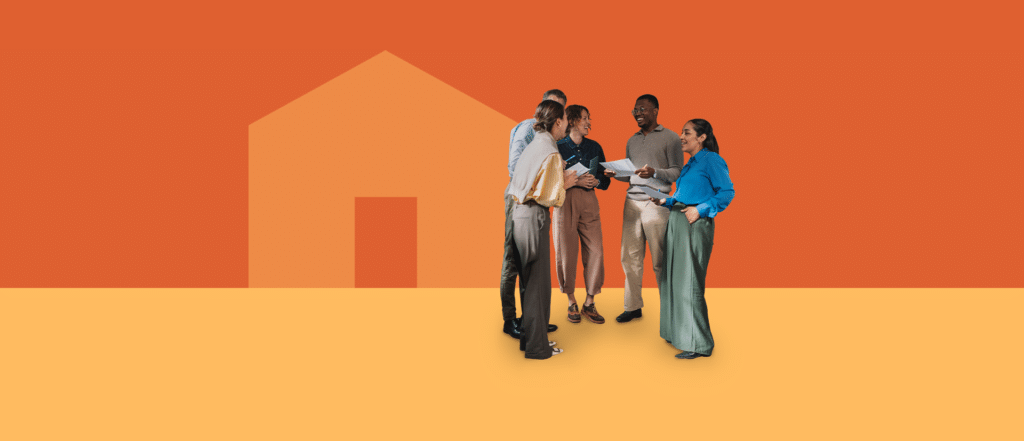 A diverse group of five adults standing together and talking, holding papers, in front of a stylized house shape on an orange and yellow background.