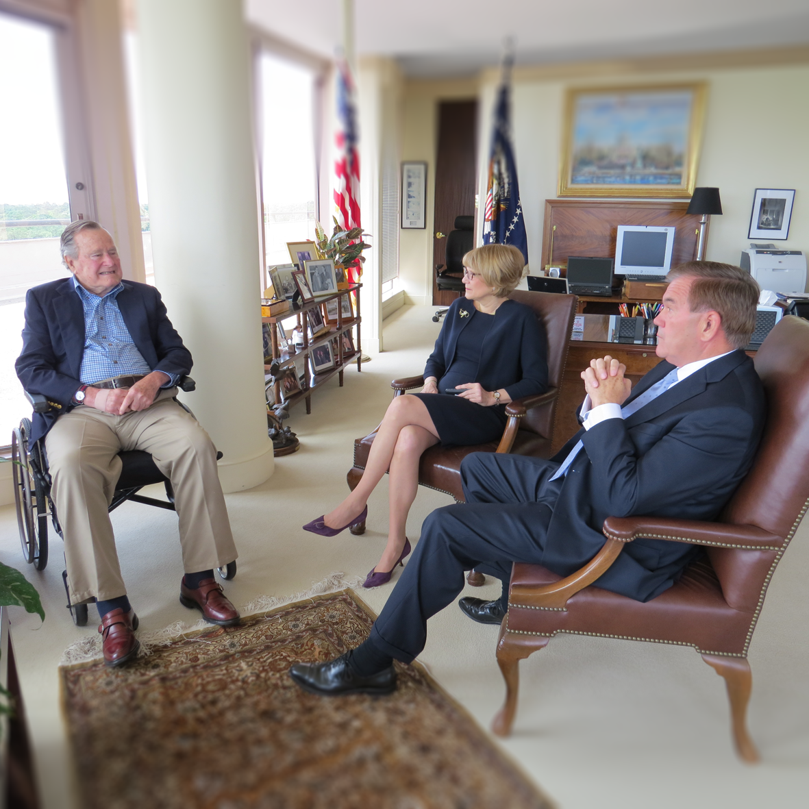 Seated from left to right: President George H. W. Bush, Carol Glazer, and Governor Tom Ridge.