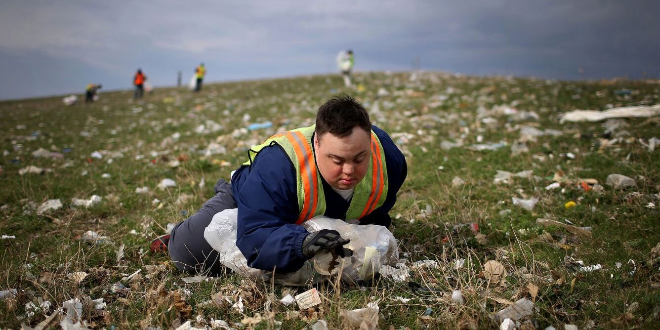 A man with Down syndrome picks up trash for his job earning subminimum wage in 2015. (David Joles/Star Tribune/TNS)