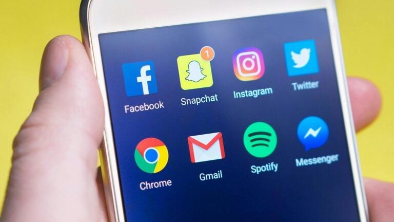 A cell phone screen showing icons for multiple social media platforms